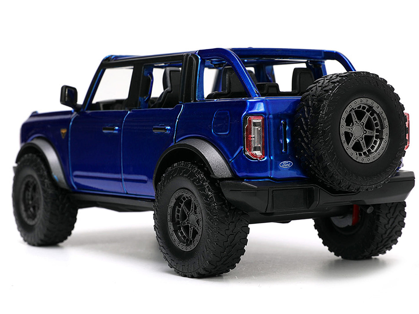 2021 Ford Bronco Open-Top Candy Blue Metallic with Extra Wheels "Just Trucks" Series 1/24 Diecast Model Car by Jada <h2>2021 Jada</h2> <p>High-quality perfect for collectors and enthusiasts. Features