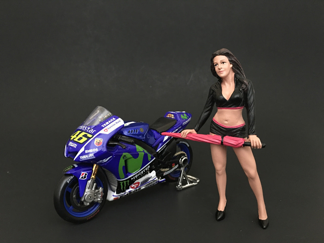 Umbrella Girl I Figure For 1:24 Scale Models by American Diorama <h2>Umbrella Diorama</h2> <p>High-quality diecast model car perfect collectors and enthusiasts. Features detailed interior exterior cra