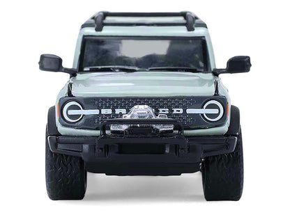 GreenLight 2021 Ford Bronco 4-Door Badlands Cactus Gray with Black Top and Motorcycle Utility Trailer "Hitch & Tow" Series 33 1/64 Diecast Model Cars by <h2>2021 Greenlight</h2> <p>High-quality car pe