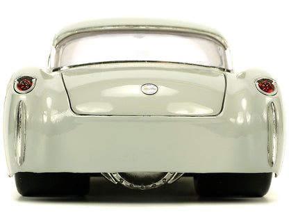 1957 Chevrolet Corvette Beige with Pink Interior Bugs Bunny Figure "Looney Tunes" "Hollywood Rides" Series 1/24 Diecast Model Car by Jada <h2>1957 Jada</h2> <p>High-quality perfect for collectors and