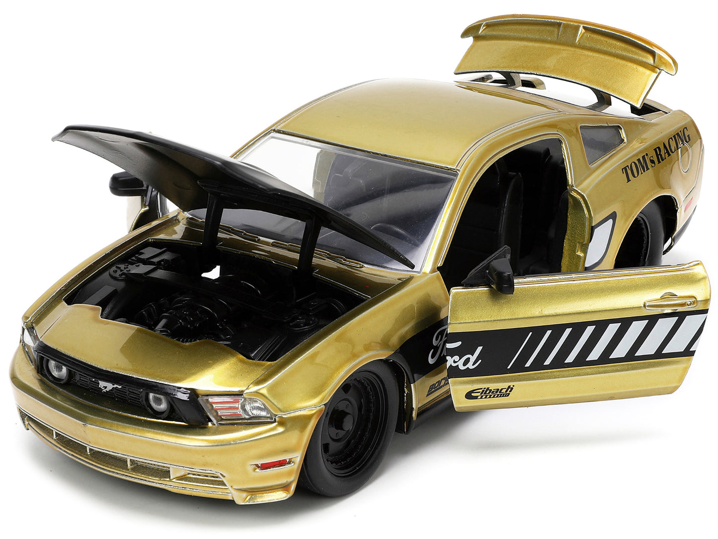 2010 Ford Mustang GT Gold Metallic with Black Graphics and Hood "Tom's Racing" "Bigtime Muscle" Series 1/24 Diecast Model Car by Jada <h2>2010 Jada</h2> <p>High-quality perfect for collectors enthusia