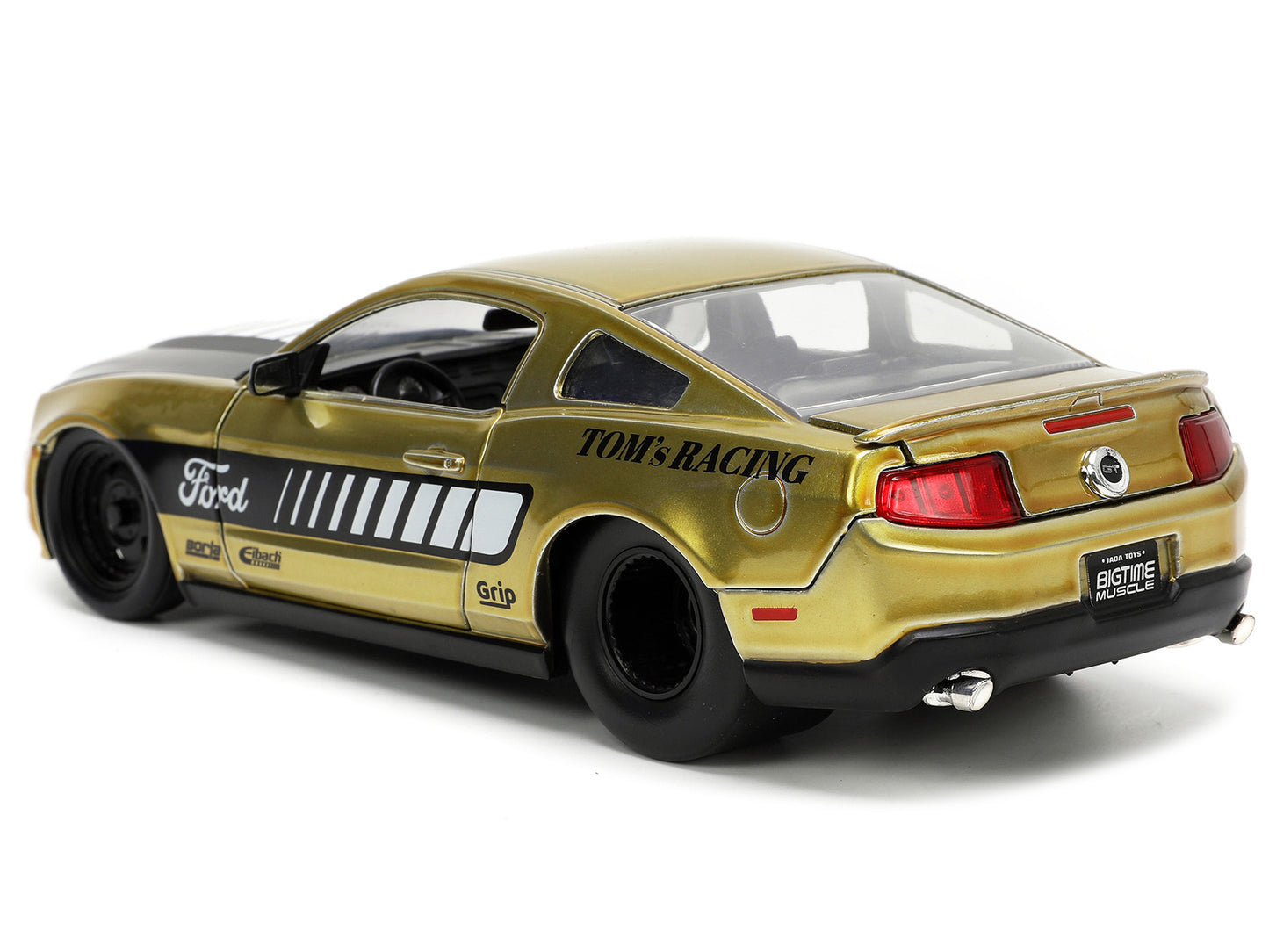2010 Ford Mustang GT Gold Metallic with Black Graphics and Hood "Tom's Racing" "Bigtime Muscle" Series 1/24 Diecast Model Car by Jada <h2>2010 Jada</h2> <p>High-quality perfect for collectors enthusia