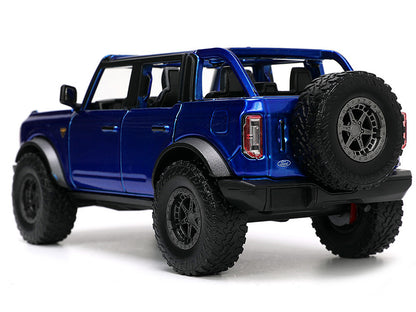 2021 Ford Bronco Open-Top Candy Blue Metallic with Extra Wheels "Just Trucks" Series 1/24 Diecast Model Car by Jada <h2>2021 Jada</h2> <p>High-quality perfect for collectors and enthusiasts. Features