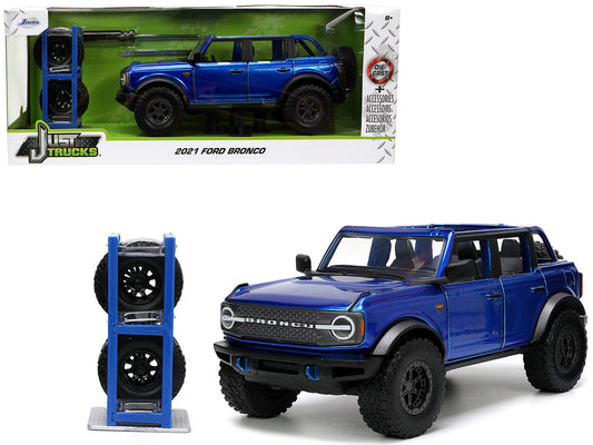 2021 Ford Bronco Open-Top Candy Blue Metallic with Extra Wheels "Just Trucks" Series 1/24 Diecast Model Car by Jada <h2>2021 Jada</h2> <p>High-quality perfect for collectors and enthusiasts. Features