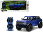 2021 Ford Bronco Open-Top Candy Blue Metallic with Extra Wheels "Just Trucks" Series 1/24 Diecast Model Car by Jada <h2>2021 Jada</h2> <p>High-quality perfect for collectors and enthusiasts. Features