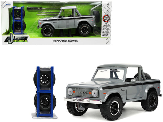 1973 Ford Bronco Pickup Truck Gray with Black Stripes Extra Wheels "Just Trucks" Series 1/24 Diecast Model Car by Jada <h2>1973 Jada</h2> <p>High-quality perfect for collectors and enthusiasts. Featur