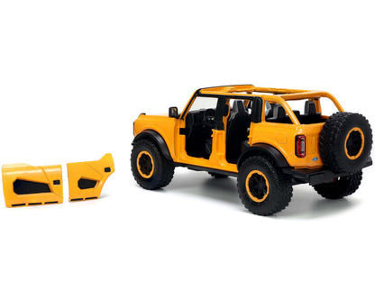 2021 Ford Bronco Orange Metallic with Extra Wheels "Just Trucks" Series 1/24 Diecast Model Car by Jada <h2>2021 Jada</h2> <p>High-quality perfect for collectors and enthusiasts. Features detailed inte