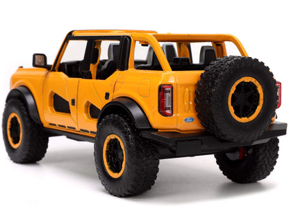 2021 Ford Bronco Orange Metallic with Extra Wheels "Just Trucks" Series 1/24 Diecast Model Car by Jada <h2>2021 Jada</h2> <p>High-quality perfect for collectors and enthusiasts. Features detailed inte