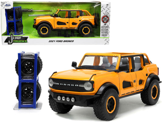 2021 Ford Bronco Orange Metallic with Extra Wheels "Just Trucks" Series 1/24 Diecast Model Car by Jada <h2>2021 Jada</h2> <p>High-quality perfect for collectors and enthusiasts. Features detailed inte
