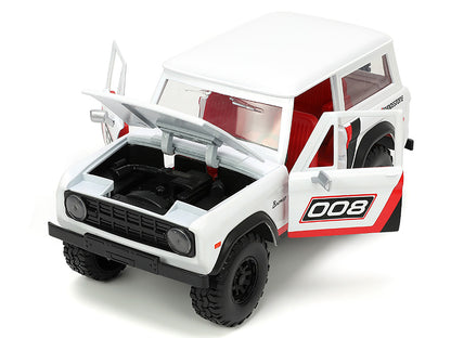 1973 Ford Bronco #008 White with Red and Black Stripes Interior Extra Wheels "Just Trucks" Series 1/24 Diecast Model Car by Jada <h2>1973 Jada</h2> <p>High-quality perfect for collectors enthusiasts.