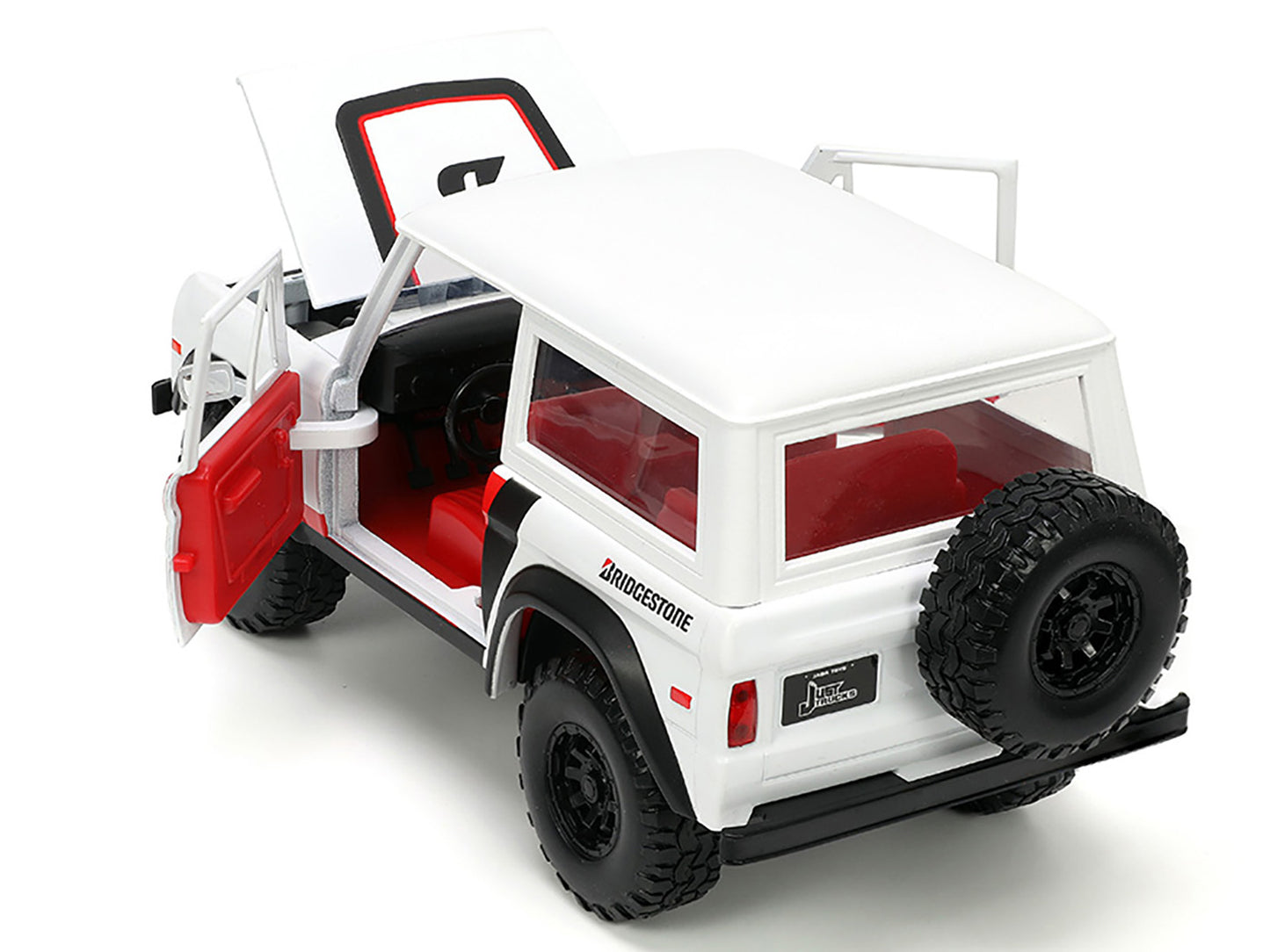 1973 Ford Bronco #008 White with Red and Black Stripes Interior Extra Wheels "Just Trucks" Series 1/24 Diecast Model Car by Jada <h2>1973 Jada</h2> <p>High-quality perfect for collectors enthusiasts.
