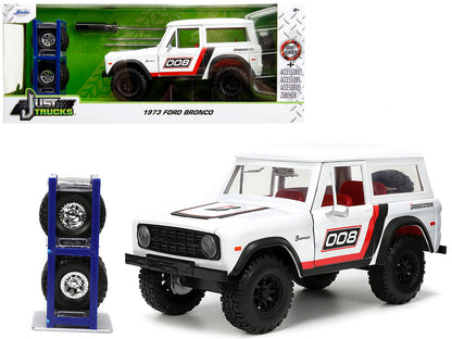 1973 Ford Bronco #008 White with Red and Black Stripes Interior Extra Wheels "Just Trucks" Series 1/24 Diecast Model Car by Jada <h2>1973 Jada</h2> <p>High-quality perfect for collectors enthusiasts.