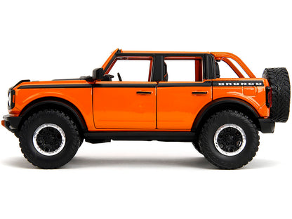 2021 Ford Bronco Open-Top Orange with Black Stripes and Hood Extra Wheels "Just Trucks" Series 1/24 Diecast Model Car by Jada <h2>2021 Jada</h2> <p>High-quality perfect for collectors enthusiasts. Fea