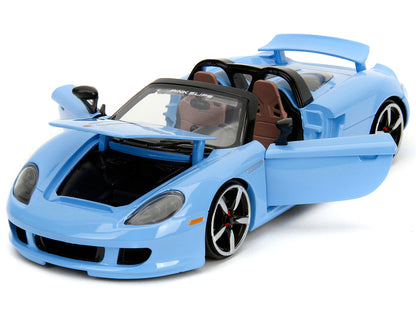 Porsche Carrera GT Convertible Blue with Black Stripes "Pink Slips" Series 1/24 Diecast Model Car by Jada <h2>Porsche Jada</h2> <p>High-quality perfect for collectors and enthusiasts. Features detaile