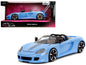 Porsche Carrera GT Convertible Blue with Black Stripes "Pink Slips" Series 1/24 Diecast Model Car by Jada <h2>Porsche Jada</h2> <p>High-quality perfect for collectors and enthusiasts. Features detaile