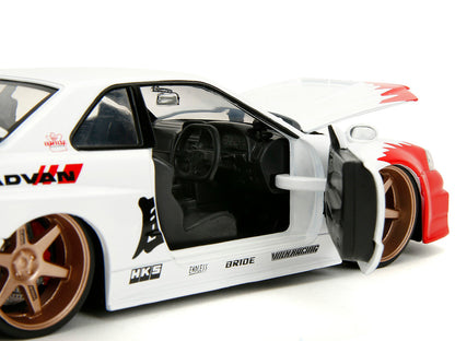 2002 Nissan Skyline GT-R (R34) RHD (Right Hand Drive) White with Red Graphics and Ryu Diecast Figure "Street Fighter" Video Game "Anime Hollywood Rides" Series 1/24 Model Car by Jada <h2>2002 Jada</h2