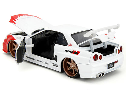 2002 Nissan Skyline GT-R (R34) RHD (Right Hand Drive) White with Red Graphics and Ryu Diecast Figure "Street Fighter" Video Game "Anime Hollywood Rides" Series 1/24 Model Car by Jada <h2>2002 Jada</h2