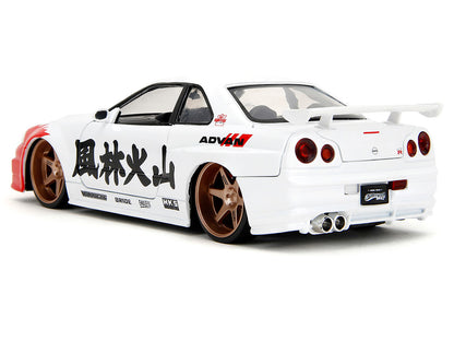 2002 Nissan Skyline GT-R (R34) RHD (Right Hand Drive) White with Red Graphics and Ryu Diecast Figure "Street Fighter" Video Game "Anime Hollywood Rides" Series 1/24 Model Car by Jada <h2>2002 Jada</h2