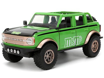 2021 Ford Bronco Green with Black Stripes and M&M's Diecast Figure "Hollywood Rides" Series 1/24 Model Car by Jada <h2>2021 Jada</h2> <p>High-quality perfect for collectors enthusiasts. Features detai