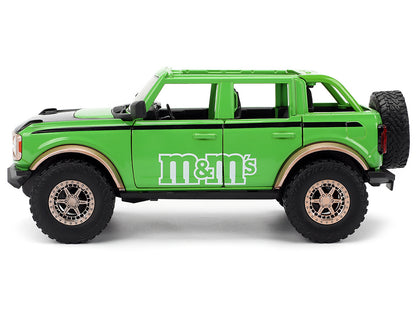 2021 Ford Bronco Green with Black Stripes and M&M's Diecast Figure "Hollywood Rides" Series 1/24 Model Car by Jada <h2>2021 Jada</h2> <p>High-quality perfect for collectors enthusiasts. Features detai