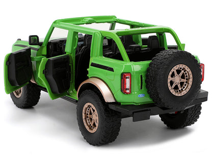 2021 Ford Bronco Green with Black Stripes and M&M's Diecast Figure "Hollywood Rides" Series 1/24 Model Car by Jada <h2>2021 Jada</h2> <p>High-quality perfect for collectors enthusiasts. Features detai