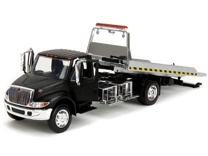 International DuraStar 4400 Flatbed Tow Truck Matt Black 1/24 Diecast Model Car by Jada <h2>International Jada</h2> <p>High-quality perfect for collectors and enthusiasts. Features detailed interior e