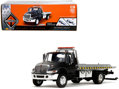 International DuraStar 4400 Flatbed Tow Truck Matt Black 1/24 Diecast Model Car by Jada <h2>International Jada</h2> <p>High-quality perfect for collectors and enthusiasts. Features detailed interior e