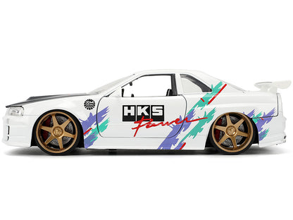 2002 Nissan Skyline GT-R (R34) RHD (Right Hand Drive) "HKS Power" White with Carbon Hood and Graphics "JDM Tuners" Series 1/24 Diecast Model Car by Jada <h2>2002 Jada</h2> <p>High-quality perfect for