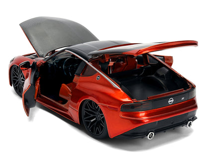 2023 Nissan Z Orange Metallic with Carbon Hood and Black Top "JDM Tuners" Series 1/24 Diecast Model Car by Jada <h2>2023 Jada</h2> <p>High-quality perfect for collectors enthusiasts. Features detailed