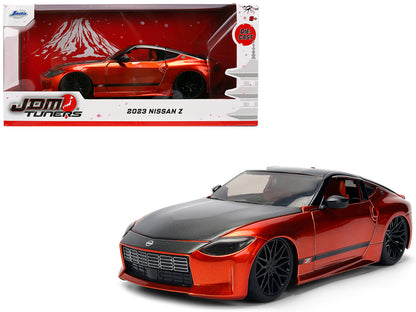 2023 Nissan Z Orange Metallic with Carbon Hood and Black Top "JDM Tuners" Series 1/24 Diecast Model Car by Jada <h2>2023 Jada</h2> <p>High-quality perfect for collectors enthusiasts. Features detailed