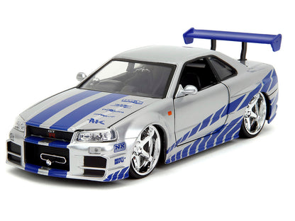 Brian's Nissan Skyline GT-R (R34) Silver Metallic with Blue Stripes and Suki's Honda S2000 Pink Graphics Set of 2 Cars "Fast & Furious 25th Anniversary" Furious" Series 1/24 Diecast Model by Jada Car