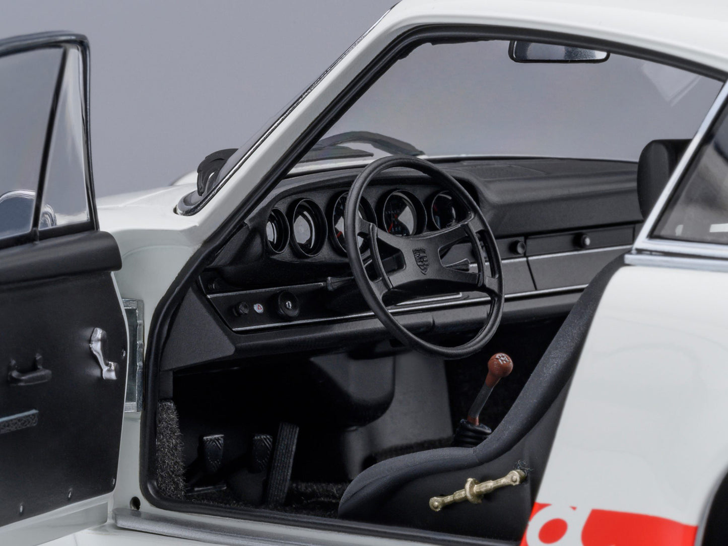 Porsche 911 Carrera 2.7 RS "The Circuit Wolf" White with Red Stripes and Wheels Hood Graphics 1/18 Model Car by Autoart <h2>Porsche Autoart</h2> <p>High-quality diecast perfect for collectors enthusia