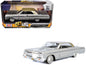 1964 Chevrolet Impala Lowrider Hard Top Silver Metallic with Gold "Get Low" Series 1/24 Diecast Model Car by Motormax <h2>1964 Motormax</h2> <p>High-quality perfect for collectors and enthusiasts. Fea