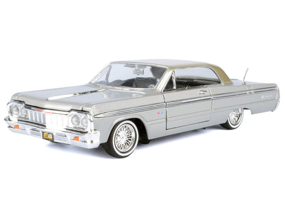 1964 Chevrolet Impala Lowrider Hard Top Silver Metallic with Gold "Get Low" Series 1/24 Diecast Model Car by Motormax <h2>1964 Motormax</h2> <p>High-quality perfect for collectors and enthusiasts. Fea