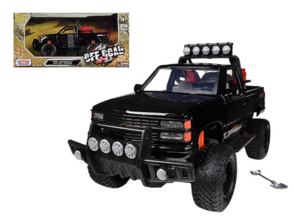 1992 Chevrolet 454 SS Pickup Truck Off Road Black 1/24 Diecast Model by Motormax <h2>1992 Motormax</h2> <p>High-quality car perfect for collectors and enthusiasts. Features detailed interior exterior