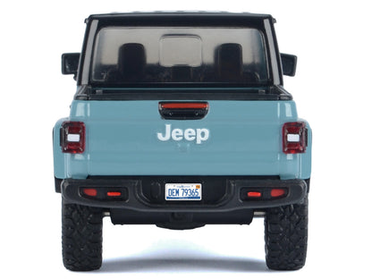 2021 Jeep Gladiator Rubicon (Closed Top) Pickup Truck Blue with Black Top 1/27 Diecast Model Car by Motormax <h2>2021 Motormax</h2> <p>High-quality perfect for collectors and enthusiasts. Features det