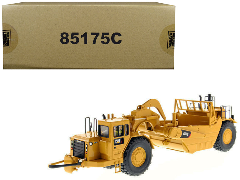 CAT Caterpillar 657 G Wheel Tractor Scraper with Operator "Core Classics Series" 1/50 Diecast Model by Masters <h2>CAT Masters</h2> <p>High-quality car perfect for collectors and enthusiasts. Features