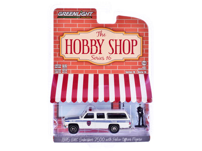 GreenLight 1985 GMC Suburban 2500 "New York City Transit Police Department" White with Blue Stripes and Officer Figure "The Hobby Shop" Series 16 1/64 Diecast Model Car by <h2>1985 Greenlight</h2> <p>
