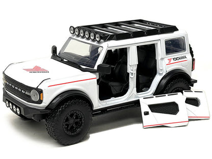 2021 Ford Bronco White with Red Stripes and Roof Rack "Yokohama Tires" "Just Trucks" Series 1/24 Diecast Model Car by Jada <h2>2021 Jada</h2> <p>High-quality perfect for collectors enthusiasts. Featur