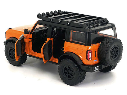 2021 Ford Bronco Orange with Black Stripes and Roof Rack "Just Trucks" Series 1/24 Diecast Model Car by Jada <h2>2021 Jada</h2> <p>High-quality perfect for collectors enthusiasts. Features detailed in