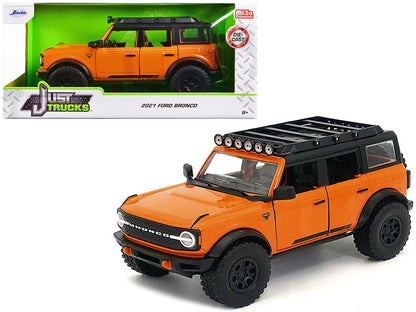 2021 Ford Bronco Orange with Black Stripes and Roof Rack "Just Trucks" Series 1/24 Diecast Model Car by Jada <h2>2021 Jada</h2> <p>High-quality perfect for collectors enthusiasts. Features detailed in