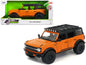 2021 Ford Bronco Orange with Black Stripes and Roof Rack "Just Trucks" Series 1/24 Diecast Model Car by Jada <h2>2021 Jada</h2> <p>High-quality perfect for collectors enthusiasts. Features detailed in