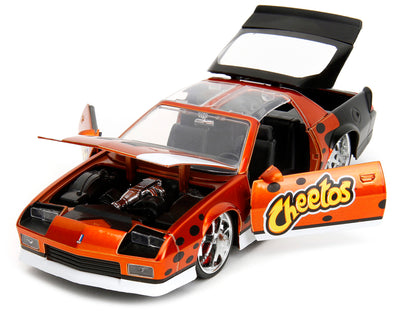 1985 Chevrolet Camaro Z/28 Orange Metallic with Graphics and Chester Cheetah Diecast Figure "Cheetos" "Hollywood Rides" Series 1/24 Model Car by Jada <h2>1985 Jada</h2> <p>High-quality perfect for col