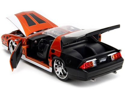 1985 Chevrolet Camaro Z/28 Orange Metallic with Graphics and Chester Cheetah Diecast Figure "Cheetos" "Hollywood Rides" Series 1/24 Model Car by Jada <h2>1985 Jada</h2> <p>High-quality perfect for col